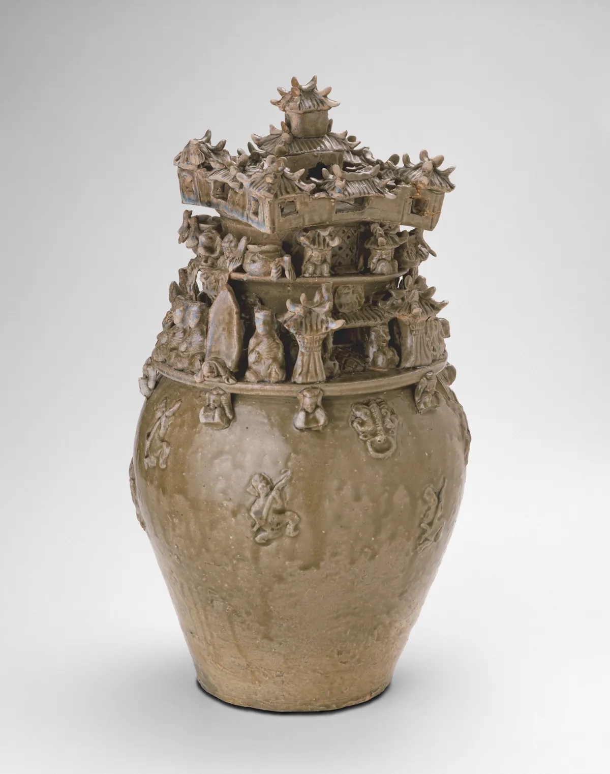 Chinese funerary urn, a hunping, crowded with modelled figures and buildings, late 3rd century